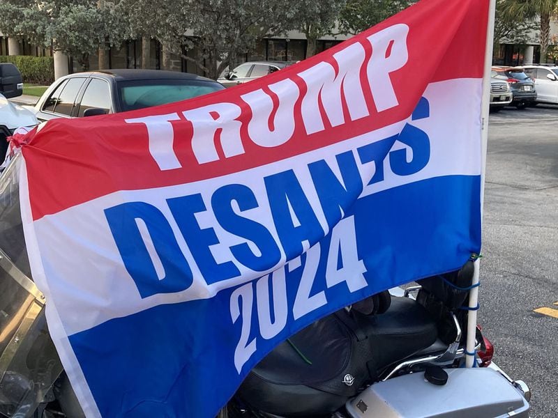 A banner supporting the idea of a 2024 Republican ticket featuring former President Donald Trump and, for vice president, Florida Gov. Ron DeSantis, outside a May rally in West Palm Beach at which DeSantis signed a law making it harder for some people to vote. (Anthony Man/South Florida Sun Sentinel/TNS)