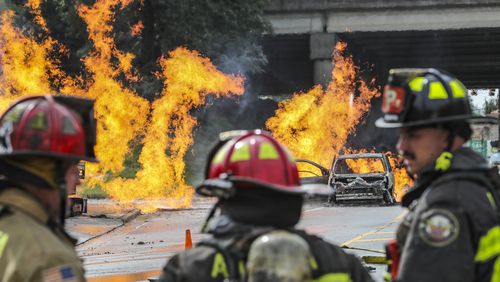 September 20, 2023 Atlanta: Firefighters continued to battle a massive gas fire in southwest Atlanta on Wednesday morning, Sept. 20, 2023 shut down several roads, including a major highway. The blaze was reported around 10:45 a.m. at 2049 Sylvan Road near the entrance to Langford Parkway in the Sylvan Hills neighborhood. Photos showed flames engulfing a charred vehicle and spread along a section of the road and sidewalk. A contractor was working on a 4-inch plastic natural gas main line and damaged it, causing his tractor to ignite, which then spread to an area surrounding a Chevron gas station, Atlanta Gas Light spokesperson Holly Lovett told The Atlanta Journal-Constitution. She noted that the work and digging by the contractor, who wasn’t part of their company, was done outside of the gas station. “The flames got pretty big, causing things around the Chevron to catch on fire,” she said. Over the next hour, firefighters worked to tackle the blaze. By 12:05 p.m., the gas was turned off and the area was secured, Lovett said. Most of the flames had been extinguished by 12:20 p.m. “Atlanta Gas Light crews are on the scene working with first responders to safely secure the area,” the company said in a statement. “Once the area is safe, Atlanta Gas Light will work to make repairs. There are no outages for customers at this time and no injuries have been reported.” Some businesses in the area had to be evacuated, Channel 2 Action News reported, including a nearby day care. The people who were in the car that caught on fire got out safely, according to the news station. According to the Georgia Department of Transportation, all westbound lanes were blocked on Langford Parkway at Sylvan Road. Drivers were asked to use I-20 or Metropolitan Parkway. (John Spink / John.Spink@ajc.com)

