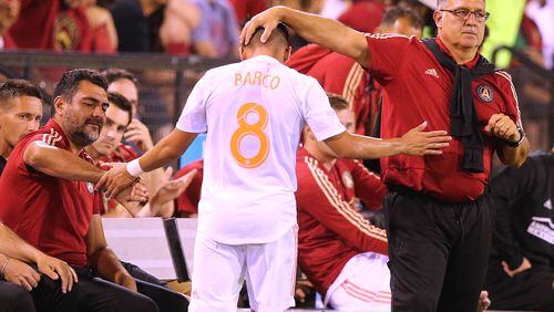 Atlanta United head coach Gerardo Martino gives Ezequiel Barco, who had a goal in the game, a pat on the head as he comes out of the game against Charleston Battery in a U.S. Open Cup match on Wednesday, June 6, 2018, in Kennesaw.