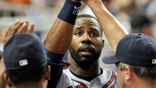 Braves right fielder Jason Heyward celebrates with teammates after scoring a run during the sixth inning Monday against the Miami Marlins at Marlins Park in Miami.
