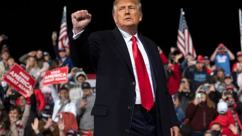 US President Donald Trump holds up his fist as he leaves the stage at the end of a rally to support Republican Senate candidates at Valdosta Regional Airport in Valdosta, Georgia on December 5, 2020. - President Donald Trump ventures out of Washington on Saturday for his first political appearance since his election defeat to Joe Biden, campaigning in Georgia where two run-off races will decide the fate of the US Senate. (ANDREW CABALLERO-REYNOLDS/AFP via Getty Images/TNS)