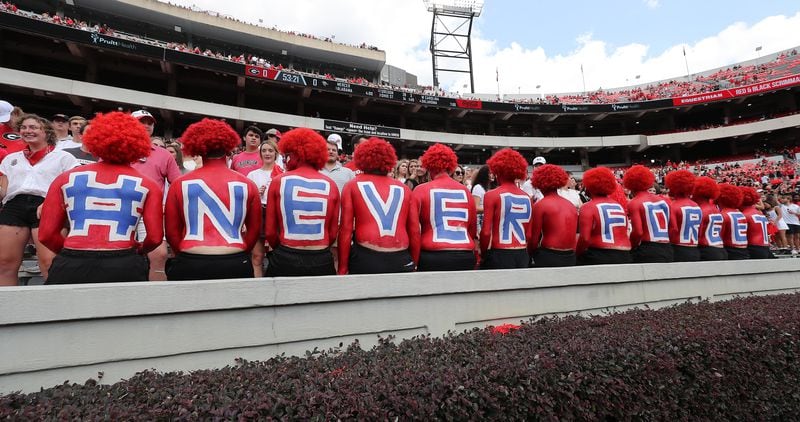 Georgia students pay tribute to 9-11 victims, bearing the letters "# NEVER FORGET" on Saturday, Sept 11, 2021, in Athens. (Curtis Compton / Curtis.Compton@ajc.com)