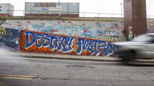 Graffiti opposing the possibility of Atlanta being chosen as Amazon’s second headquarters is shown near the Krog Street Tunnel in Atlanta, Georgia, on Wednesday, April 4, 2018. (REANN HUBER/REANN.HUBER@AJC.COM)