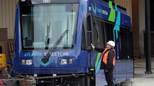 February 17, 2014 Atlanta: Mike Tomshaw, a MARTA contractor, gets a close look a the first Atlanta Streetcar to arrive Monday afternoon February 17, 2014 in Downtown Atlanta. The train was placed on its tracks, unwrapped and put in its maintenance barn after arriving from Sacramento. BEN GRAY / BGRAY@AJC.COM The federal government pitched in $47 million to fund Atlanta's streetcar. That's about $47 million more than was spent to track the number of non-criminals killed by U.S. police. (AJC file photo)