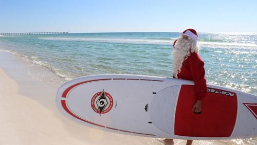 Santa enjoys Panama City Beach's sugar white sand beaches during Beach Home for the Holidays.