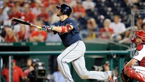 Tyler Flowers follows through on his game-winning three-run homer in the ninth inning of the Braves&#039; 11-10 win over the Nationals Monday.