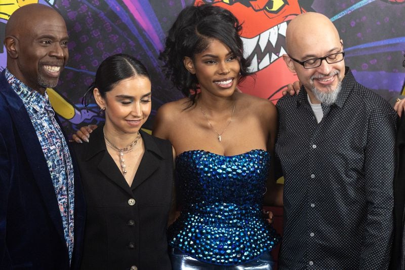 Diamond White (right center), who plays Moon Girl in "Marvel's Moon Girl & Devil Dinosaur," poses for a photograph with fellow cast members during an immersive skating event at the Cascade Skating Rink ahead of the show's season 2 premiere in Atlanta  Saturday, January. 27, 2024. (Steve Schaefer/steve.schaefer@ajc.com)