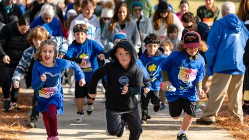 Kids run in the 13th annual Daffodil Dash at Brook Run Park in Dunwoody on Sunday, April 7, 2024. Over 800 people gathered to race in honor of the 1.5 million children who died in the Holocaust. (Ben Hendren for The Atlanta Journal-Constitution)