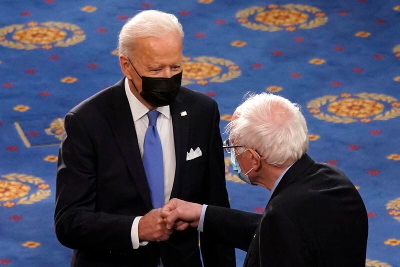 FILE - President Joe Biden greets Sen. Bernie Sanders, I-Vt., as Biden arrives to speak to a joint session of Congress in the House Chamber at the U.S. Capitol in Washington, on April 29, 2021. (AP Photo/Andrew Harnik, Pool)