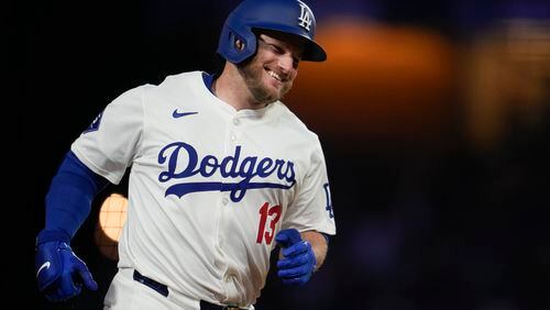 Los Angeles Dodgers' Max Muncy runs the bases after hitting a home run during the eighth inning of a baseball game against the Atlanta Braves in Los Angeles, Saturday, May 4, 2024. (AP Photo/Ashley Landis)