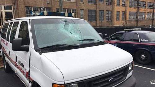 An Atlanta police van windshield was smashed with a rock Monday morning on Peachtree Street. (Credit: Heyward Wescott)