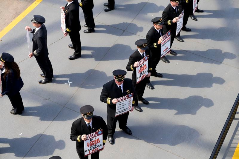 Delta Airlines pilots are seen picketing at the south terminal of Hartsfield-Jackson International Airport Thursday, March 10, 2022. The pilots are members of the Delta Airlines Pilots Association and protesting fatiguing schedules. (Daniel Varnado/For the Atlanta Journal-Constitution)