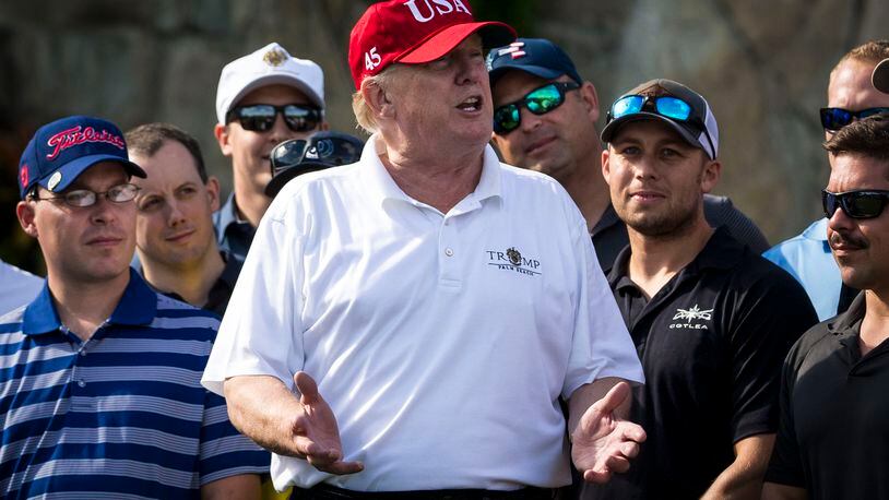 The White House this week dismissed members of an HIV/AIDS advisory council, including two members from Atlanta. President Donald Trump is pictured at a Friday gathering with Coast Guard service members at his Trump National Golf Club in West Palm Beach. (Al Drago/The New York Times)