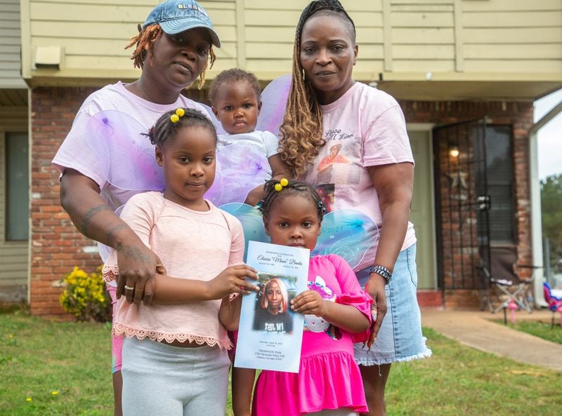 Mildred Barnett (R) poses for a photograph with her daughter Valencia Wells and her grandkids outside her Riverdale home Monday, October 25, 2021 STEVE SCHAEFER FOR THE ATLANTA JOURNAL-CONSTITUTION