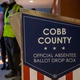12/14/2020 —  Marietta, Georgia — An official Cobb County absentee ballot drop box is displayed outside of the Cobb County Elections and Voter Registration Office in Marietta, Monday, December 14, 2020.  (Alyssa Pointer / Alyssa.Pointer@ajc.com)