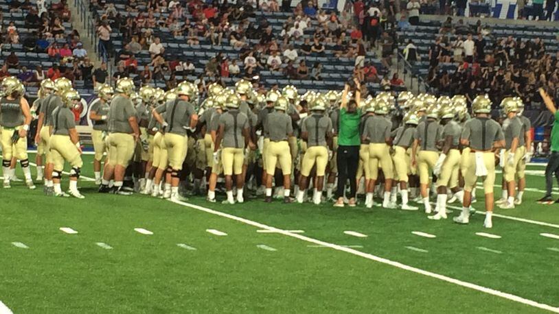 Buford players warm up before the Corky Kell opener with Hillgrove.