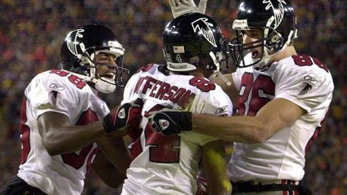 Falcons wide receivers (from left to right) Quentin McCord, Shawn Jefferson, and Brian Finneran celebrate Jefferson's touchdown catch - the first score of the game - that gave Atlanta an early lead that would quickly grow.