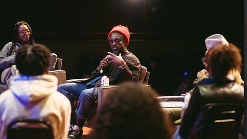 Andre 3000 speaks to students at the Ray Charles Performing Arts Center.