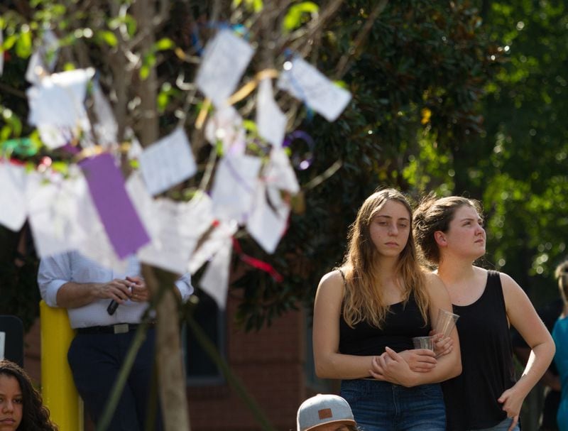 Mourners wrote notes and attached them to a tree at a memorial for Georgia Tech student Scout Schultz Sunday, September 17, 2017, In Atlanta GA. Schultz, an engineering student at Georgia Tech, was shot by Georgia Tech campus police near Curran Parking Deck after allegedly wielding a knife and telling officers to shoot him Saturday night.  STEVE SCHAEFER / SPECIAL TO THE AJC