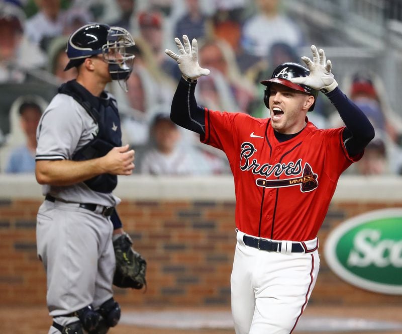 Braves' Freddie Freeman reacts to hitting a 2-run homer that proves to be the game winner for a 2-1 lead over the New York Yankees.   Curtis Compton ccompton@ajc.com 