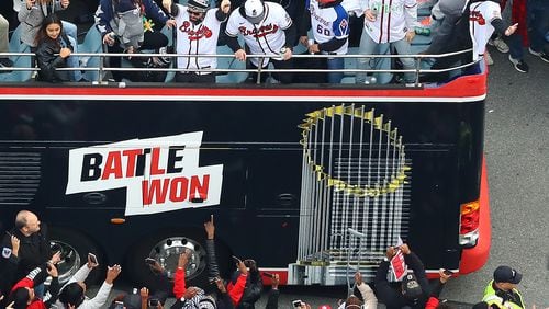 110521 ATLANTA: Players party with fans from the top of a double decker bus arriving in the Battery as the Atlanta Braves host a World Series Championship Parade and celebration on Friday, Nov. 5, 2021, in Atlanta.   “Curtis Compton / Curtis.Compton@ajc.com”