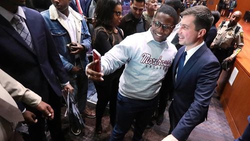 November 18, 2019 Atlanta: Morehouse College student Keron Campbell snaps a selfie with presidential hopeful Pete Buttigieg, Mayor South Bend, Indiana, as he greets students after speaking while launching a new effort to win over black voters during a conversation at Morehouse College on Monday, November 18, 2019, in Atlanta.   Curtis Compton/ccompton@ajc.com