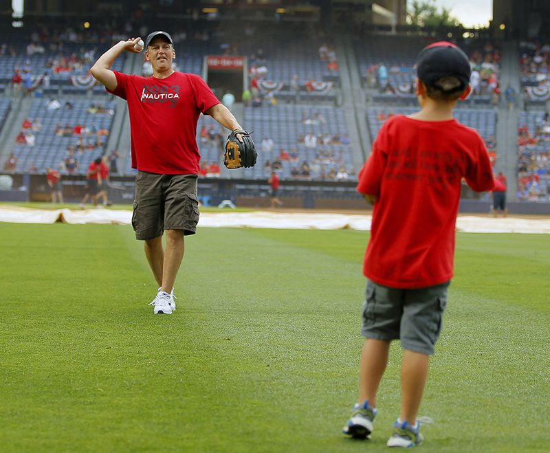 Before the game, fans had a chance to play catch on the field - in celebration of Fathers Day - at Turner Field Sunday.