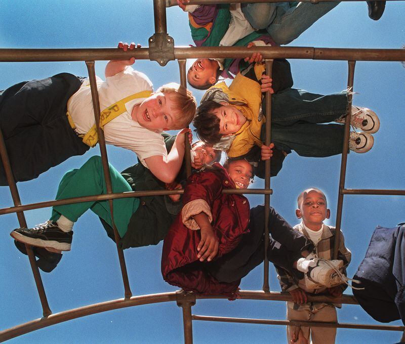 This March 26, 1999, photo was taken at Marietta's Park Street Elementary School. A group of third graders in the class of Ms. Shawn Underwood are having a good time at recess. The story was about how much the school needed new playground equipment. (Andy Sharp)