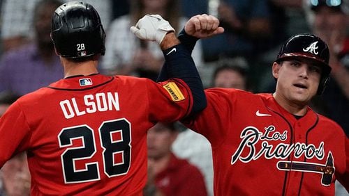 Atlanta Braves' Matt Olson (28) celebrates with Austin Riley after hitting a two-run home run in the first inning of a baseball game against the Chicago Cubs, Thursday, Sept. 28, 2023, in Atlanta. (AP Photo/John Bazemore)