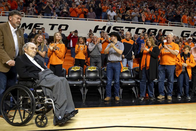 Retired coach Eddie Sutton is honored with the 1995 Oklahoma State Final Four team during halftime at Oklahoma State's 73-70 victory over Texas Tech in the NCAA college basketball game in Stillwater, Okla., Saturday, February 15, 2020. (AP Photo/Mitch Alcala)