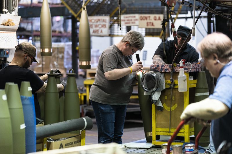 FILE -Steel workers manufacture 155 mm M795 artillery projectiles at the Scranton Army Ammunition Plant in Scranton, Pa., Thursday, April 13, 2023. The Pentagon could get weapons moving to Ukraine within days if Congress passes a long-delayed aid bill. That's because it has a network of storage sites in the U.S. and Europe that already hold the ammunition and air defense components that Kyiv desperately needs. Moving fast is critical, CIA Director Bill Burns said Thursday, April 18, 2024. (AP Photo/Matt Rourke, File)