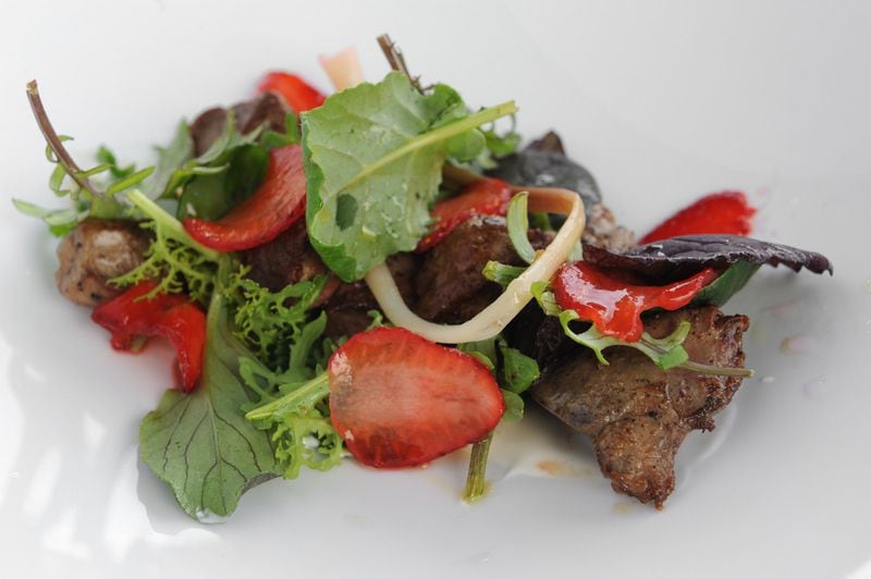 Skillet Chicken Livers with pickled ramps, wild greens, strawberries, brown butter, verjus . (Beckysteinphotography.com)