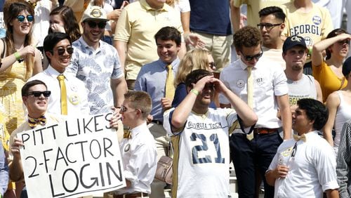 ATLANTA, GA - SEPTEMBER 23:  A Georgia Tech Yellow Jackets fan holds a sign while other fans look on during the game against the Pittsburgh Panthers at Bobby Dodd Stadium on September 23, 2017 in Atlanta, Georgia.  (Photo by Mike Zarrilli/Getty Images)