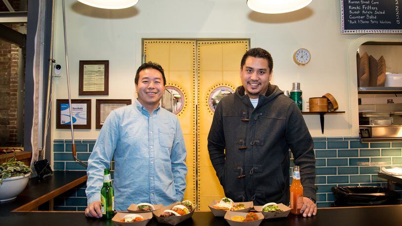 Partners Michael Lo and George Yu behind the counter at Suzy Siu’s Baos. (Photo by Mia Yakel)