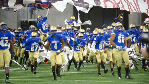 The McEachern Indians take the field at the start of their game against Brookwood at the Mercedes Benz Stadium in Atlanta during the Corky Kell Classic Saturday, August 24, 2019. PHOTO/Daniel Varnado