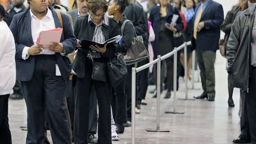 Pre-registered applicants line up for the opening of Hartsfield Jackson’s job fair Tuesday. BOB ANDRES /BANDRES@AJC.COM