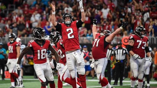 Atlanta Falcons quarterback Matt Ryan (2) reacts after scoring a touchdown against the Carolina Panthers during the second half at Mercedes-Benz Stadium.