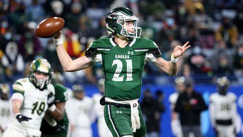 Collins Hill quarterback Sam Horn (21) attempts a pass during the first half against Grayson during the Class 7A state high school football final Dec. 30, 2020, at Center Parc Stadium in Atlanta. (Jason Getz/For the AJC)