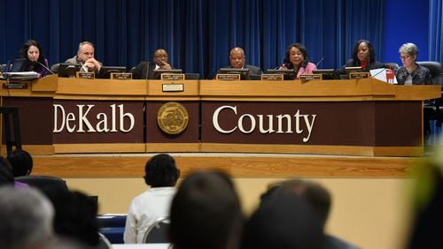 The DeKalb County Board of Commissioners couldn’t agree Tuesday on plans for a sales tax to fund road repaving, a government center and other infrastructure. From left: Commissioners Nancy Jester, Jeff Rader, Larry Johnson, Stan Watson, Sharon Barnes Sutton, Mereda Davis Johnson and Kathie Gannon. Watson resigned from the board in March. MARK NIESSE / MARK.NIESSE@AJC.COM