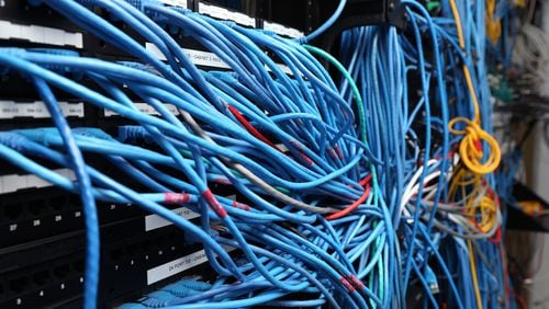 FILE - FEBRUARY 25, 2015: It was reported that the FCC is voting on new regulations that would give them authority to ensure that Internet service providers (ISPs) give consumers access to all legal content February 25, 2015. NEW YORK, NY - NOVEMBER 10:  Network cables are plugged in a server room on November 10, 2014 in New York City. U.S. President Barack Obama called on the Federal Communications Commission to implement a strict policy of net neutrality and to oppose content providers in restricting bandwith to customers.  (Photo by Michael Bocchieri/Getty Images)