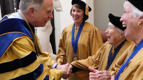 May 9,  2016 -  Dekalb County -  During the hour before commencement began, President Wagner greeted members of the Corpus Cordis Aureum, alumni who graduated 50 years ago or more, including Anne Dunivin (center), who turns 100 in October and her daughters Barbara Dunivin Garrett (left),  and Virginia Dunivin Merritt, who all graduated from Emory.  Monday was the final commencement for outgoing Emory University President James Wagner, who leaves the institution this summer after 13 years leading the internationally-known institution.  Emory University's Class of 2016 includes more than 4,500 students representing 49 states and 76 countries.  BOB ANDRES  / BANDRES@AJC.COM