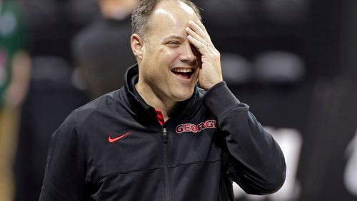 Georgia head coach Mark Fox laughs as he watches his team during practice at the NCAA college basketball tournament in Charlotte, N.C., Thursday, March 19, 2015. Georgia plays Michigan State in the second round on Friday. (AP Photo/Nell Redmond) Mark Fox was in a good mood Thursday despite Brian Gregory's comments. (AP photo)