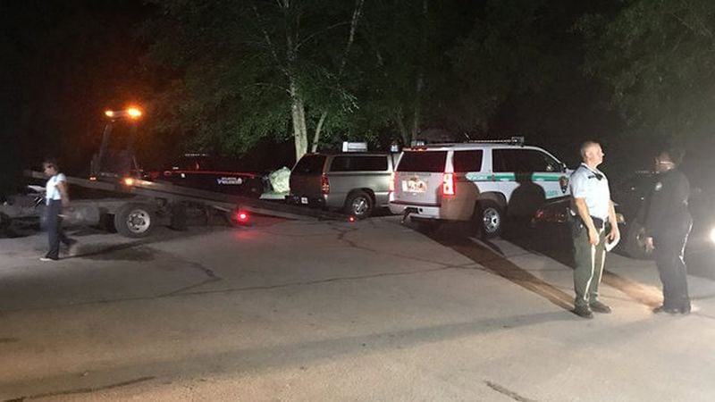 Multiple agencies responded to Whitewater Creek in northwest Atlanta after a woman walking her dog discovered a decomposing body. (Credit: Channel 2 Action News)
