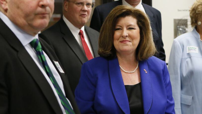Former Georgia Secretary of State Karen Handel, one of 11 Republicans running in the special election to replace Tom Price in the 6th Congressional District, used her debut ad to target Democrat Jon Ossoff over the work his investigative film company has done for Al-Jazeera, a Qatar-based network that critics describe as a propaganda outlet. BOB ANDRES /BANDRES@AJC.COM