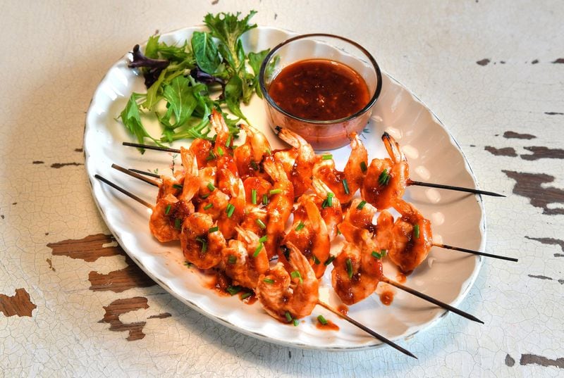 The recipe for Sambal Shrimp Skewers calls for condiments with a global flavor such as sambal oelek and Sriracha. STYLING BY SUSAN PUCKETT / CONTRIBUTED BY CHRIS HUNT PHOTOGRAPHY