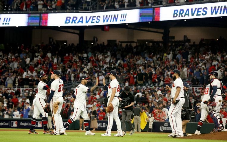 Atlanta Braves players celebrate a 3-0 win against the Philadelphia Phillies after game two of the National League Division Series at Truist Park in Atlanta on Wednesday, October 12, 2022. (Jason Getz / Jason.Getz@ajc.com)
