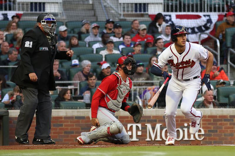 Braves' Matt Olson (28) makes his way to first base after hitting a single during a game against the Cincinnati Reds at Truist Park on Friday, April 8, 2022, in Atlanta.  Branden Camp/For the Atlanta Journal-Constitution