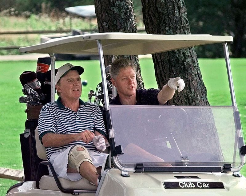 President Clinton points out some of the finer points of the first hole at Farm Neck Country Club in Oak Bluffs, Mass. to Jack Welch, CEO of General Electric, before a round of golf there Friday, Aug. 22, 1997. (AP Photo/Ruth Fremson)