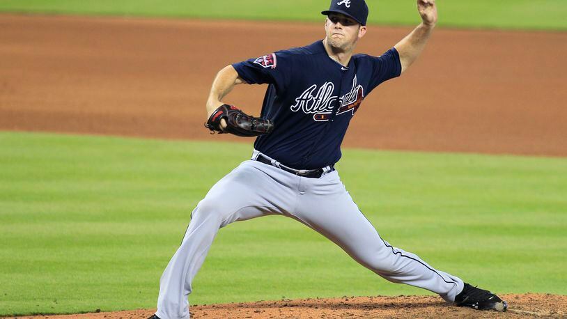 Atlanta Braves pitcher Alex Wood throws in the eighth inning against the Miami Marlins during their baseball game in Miami, Sunday, June 1, 2014. (AP Photo/Joe Skipper)