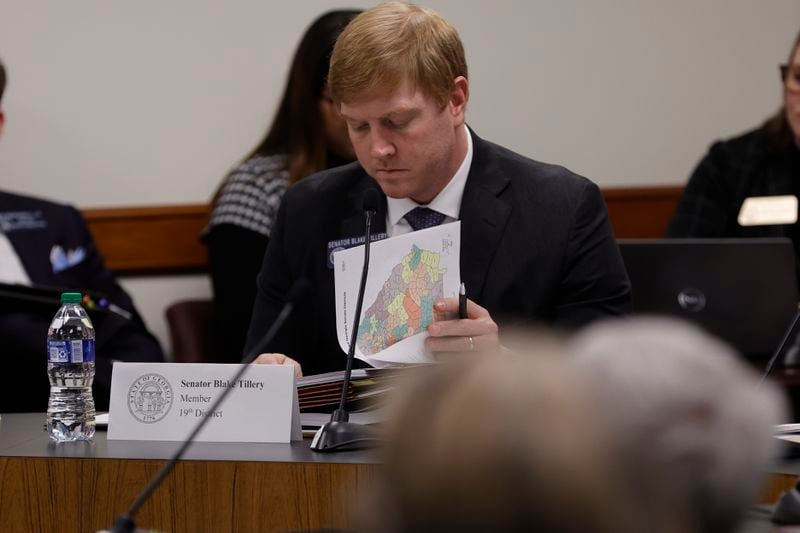 State Sen. Blake Tillery, R-Vidalia, flips through a packet with revised state legislative district maps during a hearing Wednesday at the Georgia Capitol. (Natrice Miller/ natrice.miller@ajc.com)